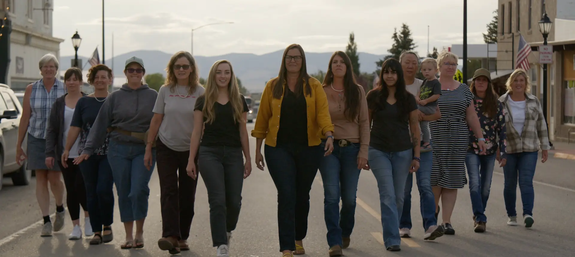 Women of White Sulphur Springs walking together down the main street of their Montana town